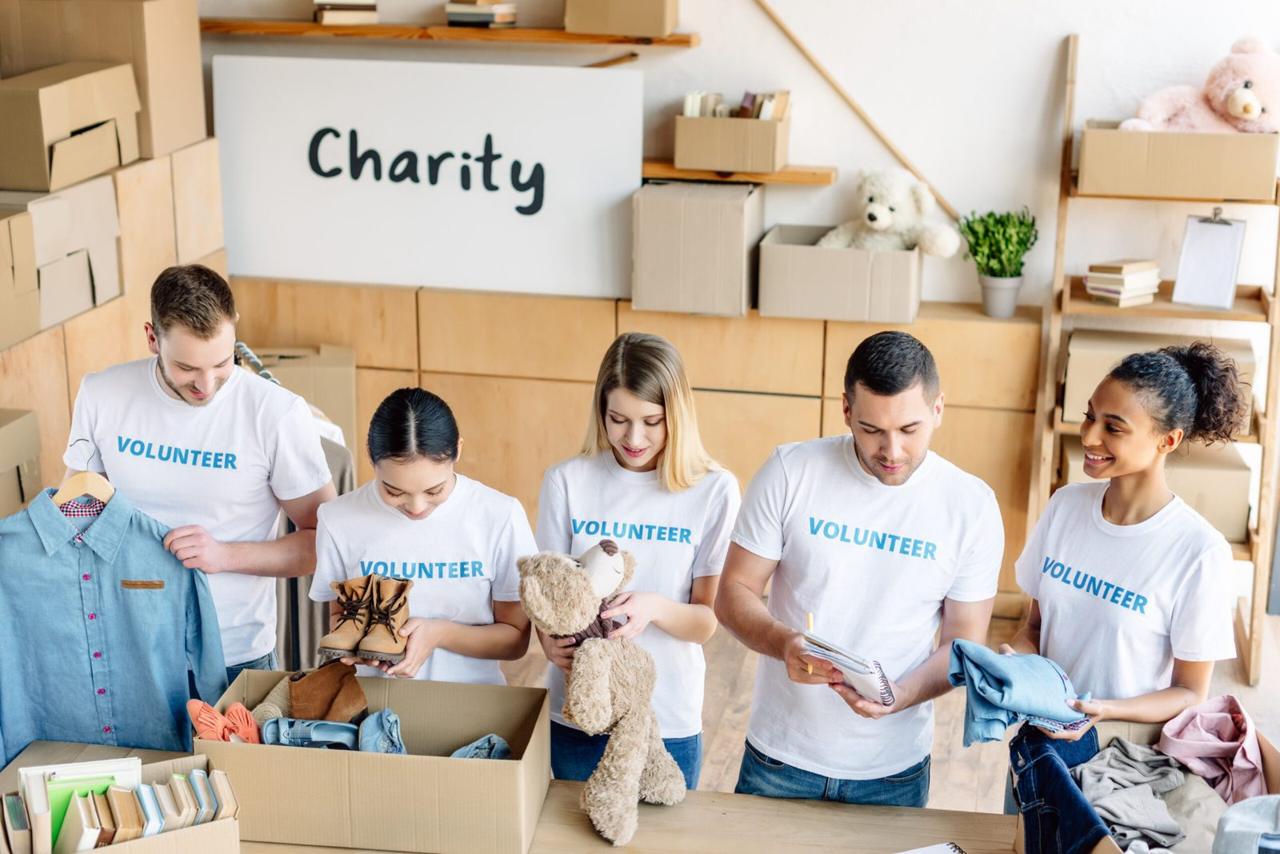 Young volunteers unpacking donation boxes together